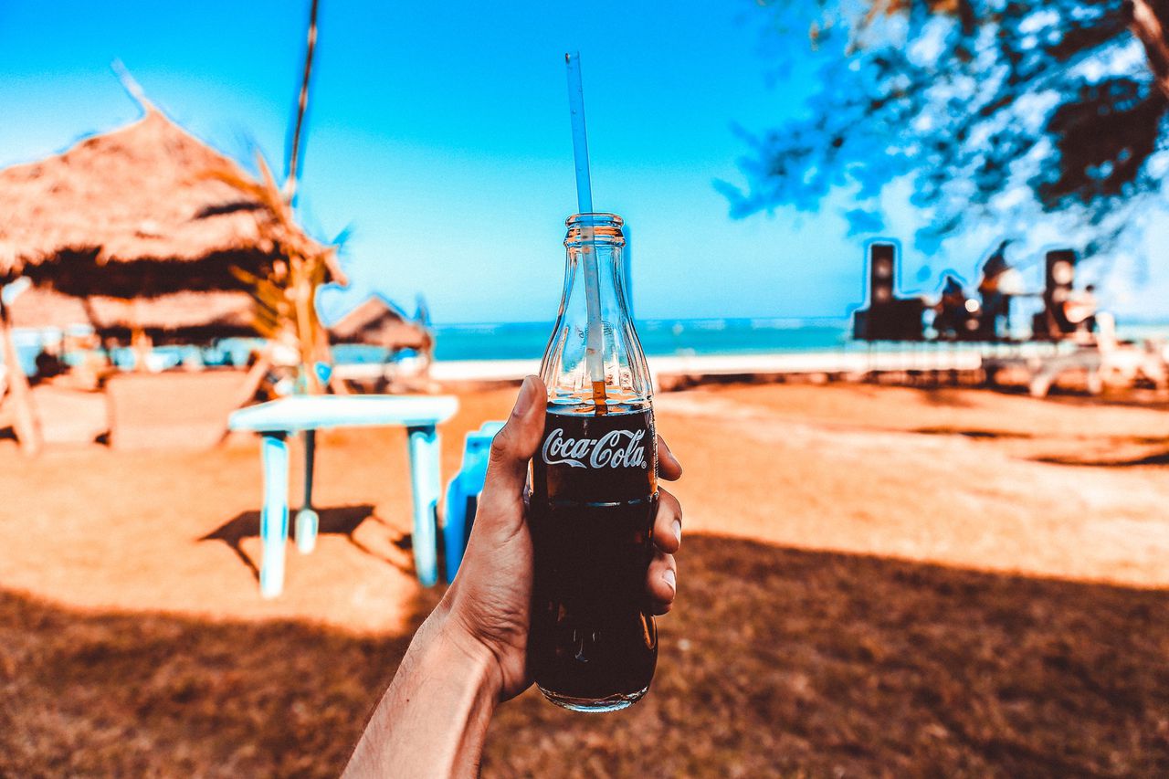 Coca Cola is committed to reducing its carbon footprint. Image Via Packaging News