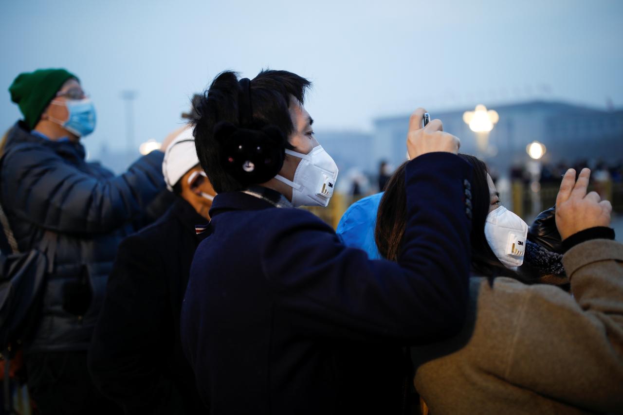 Coronavirus death toll rises to 213, 9,692 people infected. Image via Reuters.