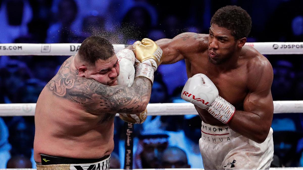 Anthony Joshua retakes heavyweight titles from Andy Ruiz Jr by unanimous decision. Image via AP.