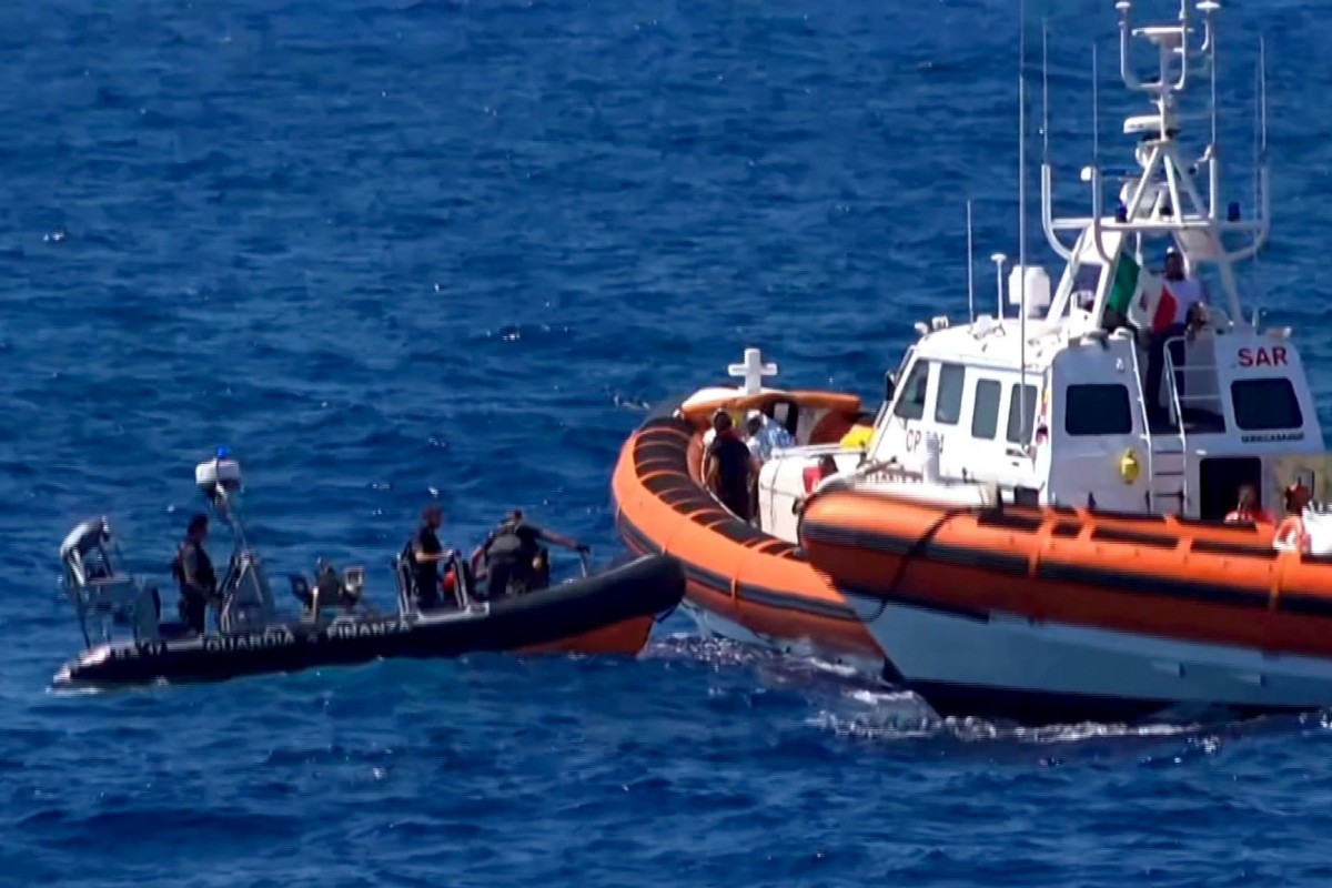 Opens Arms charity ship brings 62 African migrants safely to Italian port. Image via AFP.